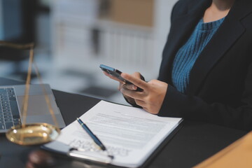 female business woman lawyers working at the law firms. Judge gavel with scales of justice. Legal law, lawyer, documents, advice and justice concept.