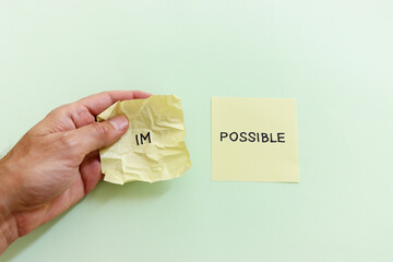 The word impossible is divided into two parts. success and challenge concept.