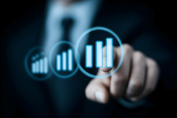A business professional interacts with a futuristic digital interface showing ascending bar charts representing growth and progress.