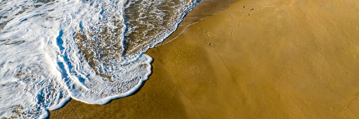 Florianópolis, Campeche beach during sunrise. Brazil. Rio Tavares neighborhood. Wave formation in web banner.