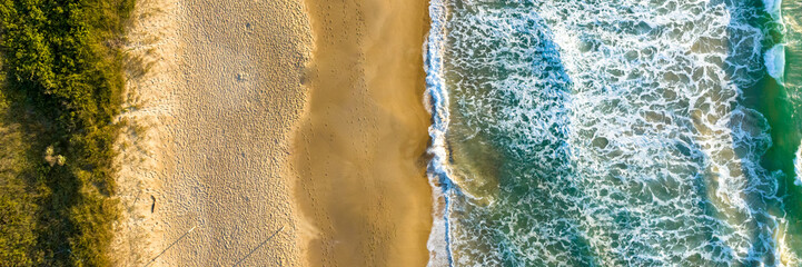 Florianópolis, Campeche beach during sunrise. Brazil. Rio Tavares neighborhood. Wave formation in web banner.
