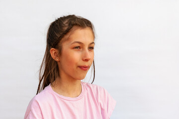 Side view girl with uneven teeth, malocclusion on white background. Concept orthodontic treatment