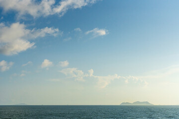 Tranquil Ocean Horizon Against a Soft Blue Sky at Dusk