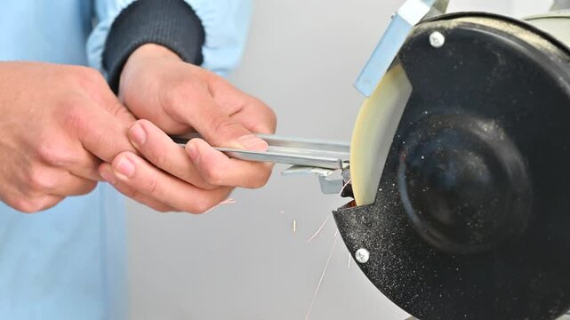 Grinding to smooth and deburr metal parts