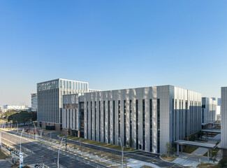 Sleek and Contemporary Office Architecture Against a Clear Blue Sky