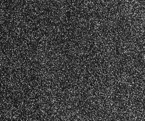Black abstract background with white film grain, grunge texture