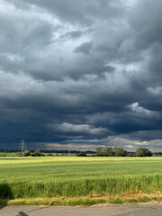 Storm Clouds Over Green Countryside Landscape