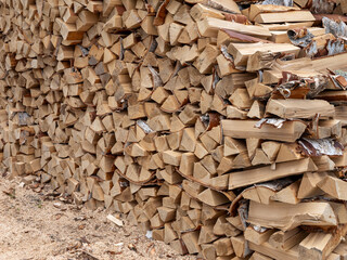 A pile of wood logs stacked on top of each other