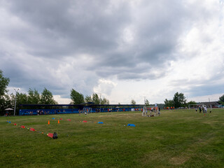 A group of people are playing soccer in a field