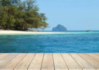 Wooden table top on the beach or sea.Party on the beach  sunshine time concept.For montage product display or design key visual layout.View of copy space.