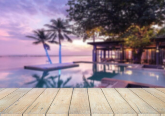 Wooden table top on the beach or sea. swimming pool Party on the beach  sunshine time concept.For montage product display or design key visual layout.View of copy space.
