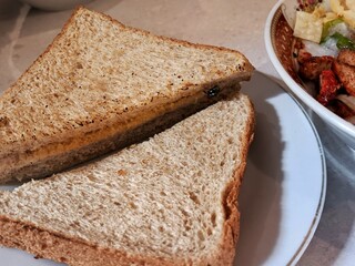 whole wheat bread that is toasted and then split, filled with margarine and granulated sugar until it feels contrasting. 