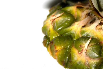 Close up of pieapple fruit skin on white background