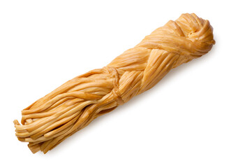 Smoked chechil cheese braid on a white background. Top view