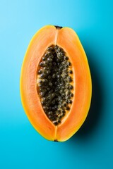A Papaya with a clean blue background