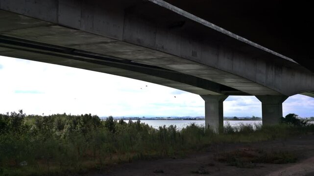 Sunlight Caustics Under Coastal Concrete Bridge