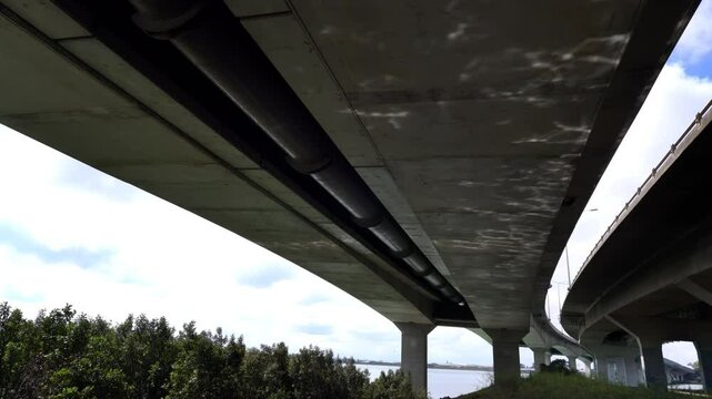 Sunlight Caustics Under Coastal Concrete Bridge