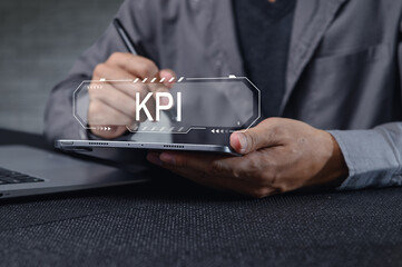 Business Professional Analyzing Key Performance Indicators on Laptop