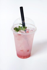 Plastic glass with bubble tea and ice. Trendy summer drink on wh