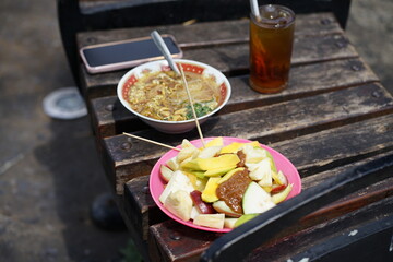 Delicious Indonesian Street Food Noodle Soup and Tropical Fruit Salad