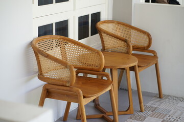 Relaxing Rattan Chairs and Wooden Table Perfect for a Cozy Corner