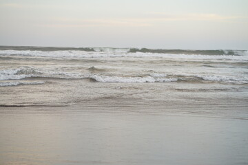 Serene Coastal Scene Ocean Waves Gently Crashing on Sandy Shore
