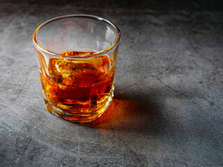 Strong alcohol drink. Whisky in glass with ice, Whisky, bourbon or cognac. Hard strong alcoholic drink