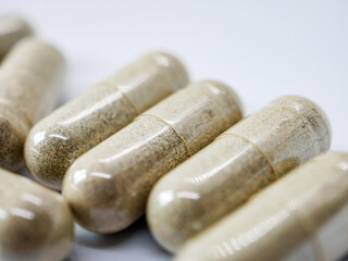 Herbal medicine capsule isolated on white background, Close-up of Herbal medicine capsule