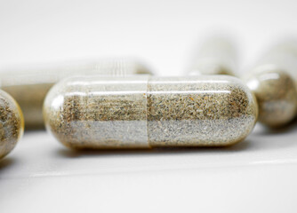 Herbal medicine capsule isolated on white background, Close-up of Herbal medicine capsule
