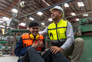 Professional asian man engineer working in warehouse, emergency during work in factory resulting in...