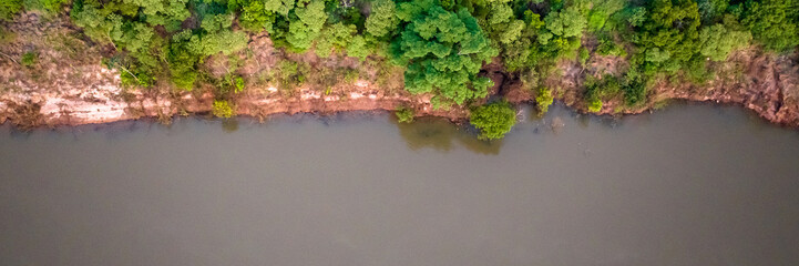 Border between Brazil and Paraguay and connects Foz do Iguacu to Ciudad del Este. Ponte da Amizade in Foz do Iguacu. Aerial view of the Friendship Bridge with Parana river. Square image.