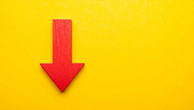 Red wooden arrow pointing down on yellow background. Business, market decline or economic. - Powered by Adobe