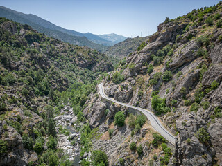 Camping Caravan driving through Canyon de la Ruda road Corsica down the pass monte Cino