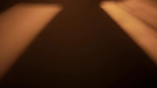 Abstract shadows, red rays coming from above, brown tones, for film production and opening credits