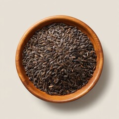 Cumin seeds in bowl, close up shot on white background