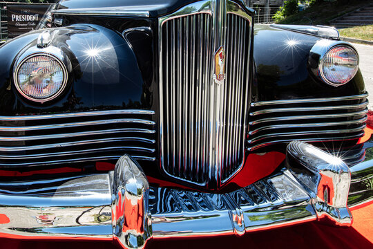 Front View of a Vintage Black Packard or ZIS-110 Car with Chrome Details