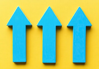 Three bright blue arrows pointing upward against a vibrant yellow background