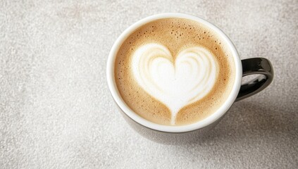 Latte art heart in black mug
