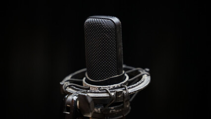 Podcast or Vocal Recording Equipment in Studio Isolated on Dark Background