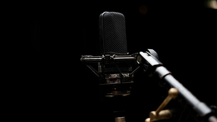 Podcast or Vocal Recording Equipment in Studio Isolated on Dark Background