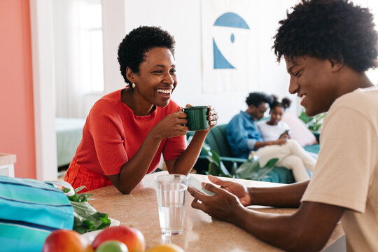 Mother and son enjoying morning time together in their home kitchen