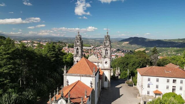 Drone Flythrough Between Bom Jesus Church Towers Revealing Braga, Portugal.Stunning 4K drone footage flying directly between the twin bell towers of the Bom Jesus do Monte sanctuary in Braga, Portugal