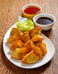 Delicious Crispy Fried Dumplings with Sweet and Sour Dipping Sauces