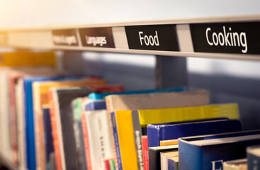 Food books and cookbooks with recipe and diet information and ideas. Bookshelf at reading library...