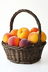 Fresh and Juicy Peaches in a Woven Basket Against White Background
