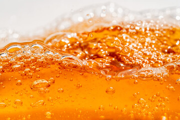 Close up bright orange Oil or beer splash texture and nature waves, Beautiful waves curve and...