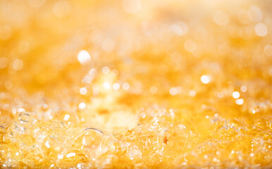 Close up bright orange Oil or beer splash texture and nature waves, Beautiful waves curve and...