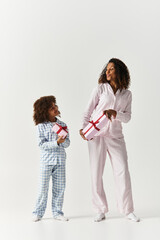 Matching morning moments African american Mother and Daughter in matching pyjamas
