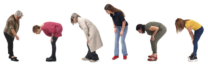side view of group of women leaning forward and looking at the ground on a white background