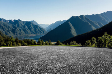 The open asphalt ground is set against the backdrop of mountains